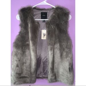 Beautiful grey vest great for day and night wear
